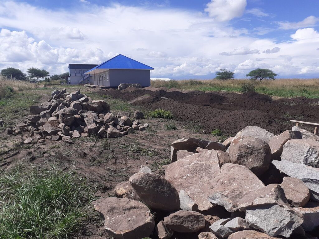 Pile of rocks near a construction site.