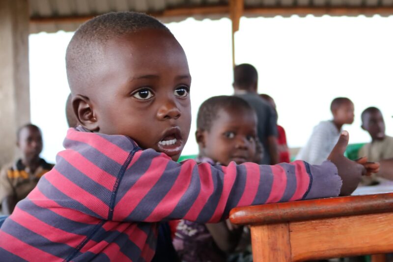 Captures children in a residential setting, indicating housing and care facilities for children.